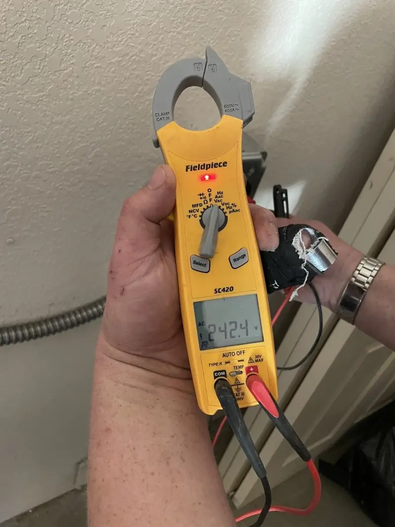 Voltage testing with clamp meter during Circuit Breaker Repair in Connersville